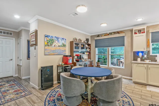 a view of a dining room with furniture window and outside view