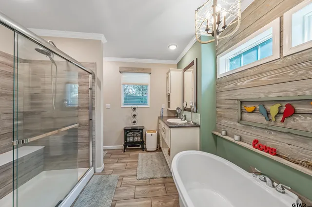 a bathroom with a sink a bathtub and a shower