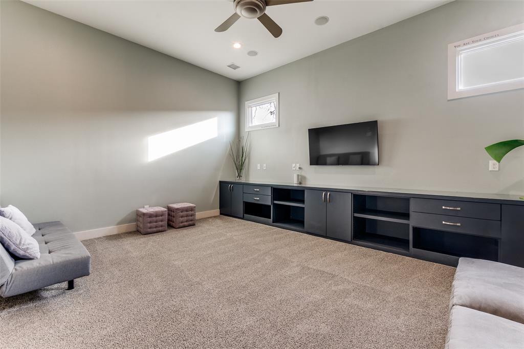 7912 Hanover Street Dallas, TX 75225 - Photo 20 of 29 Spacious playroom featuring a vaulted ceiling with a ceiling fan, recessed lighting, and soft carpet flooring