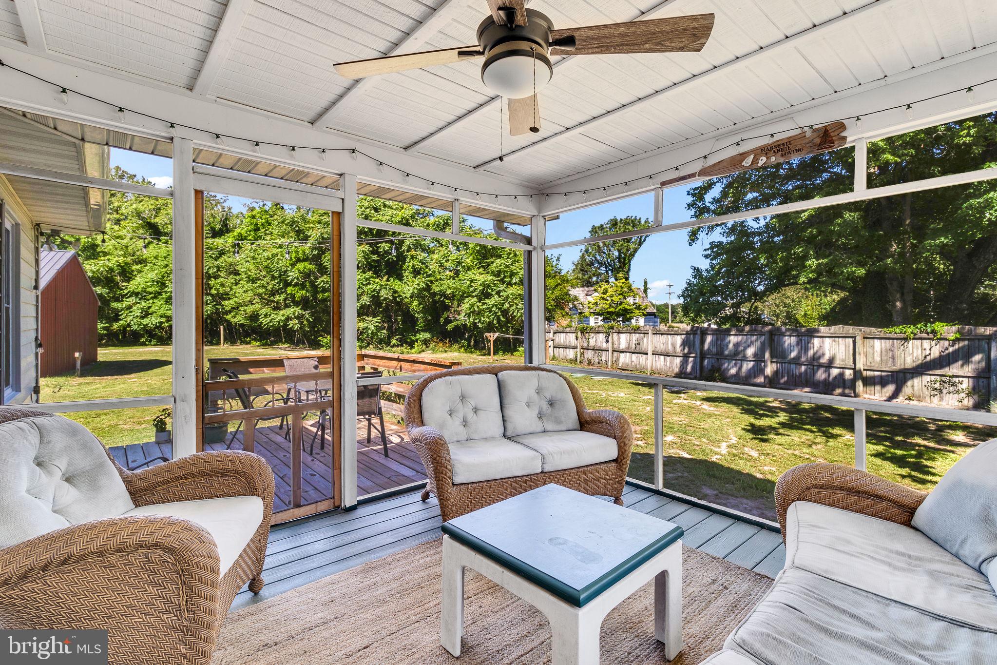 9832 River Road Lancaster, VA 22503 - Photo 18 of 68 Serene screened porch with lush views.