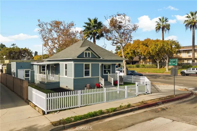 a view of multiple houses with a yard