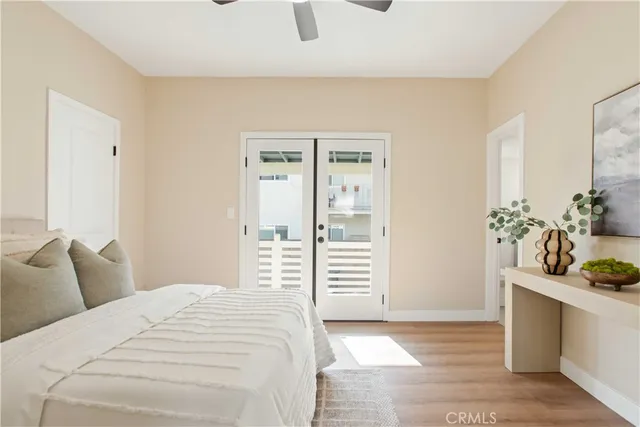 a bedroom with a bed and a potted plant