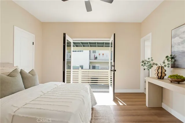 a bedroom with a bed and a potted plant
