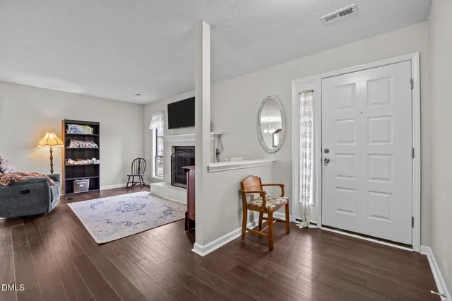 a view of a livingroom with furniture and a flat screen tv
