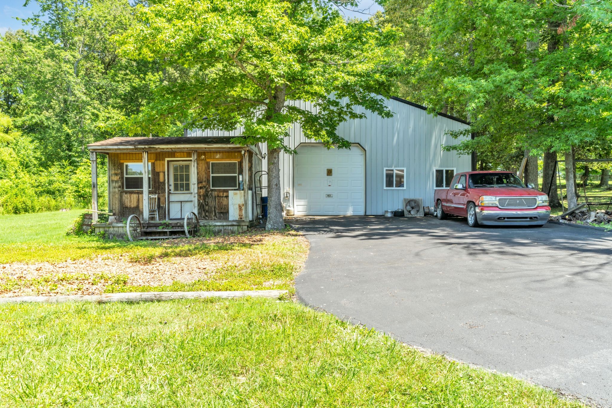 4111 Highway 49 Springfield, TN 37172 - Photo 34 of 46 a front view of a house with a yard outdoor seating and garage