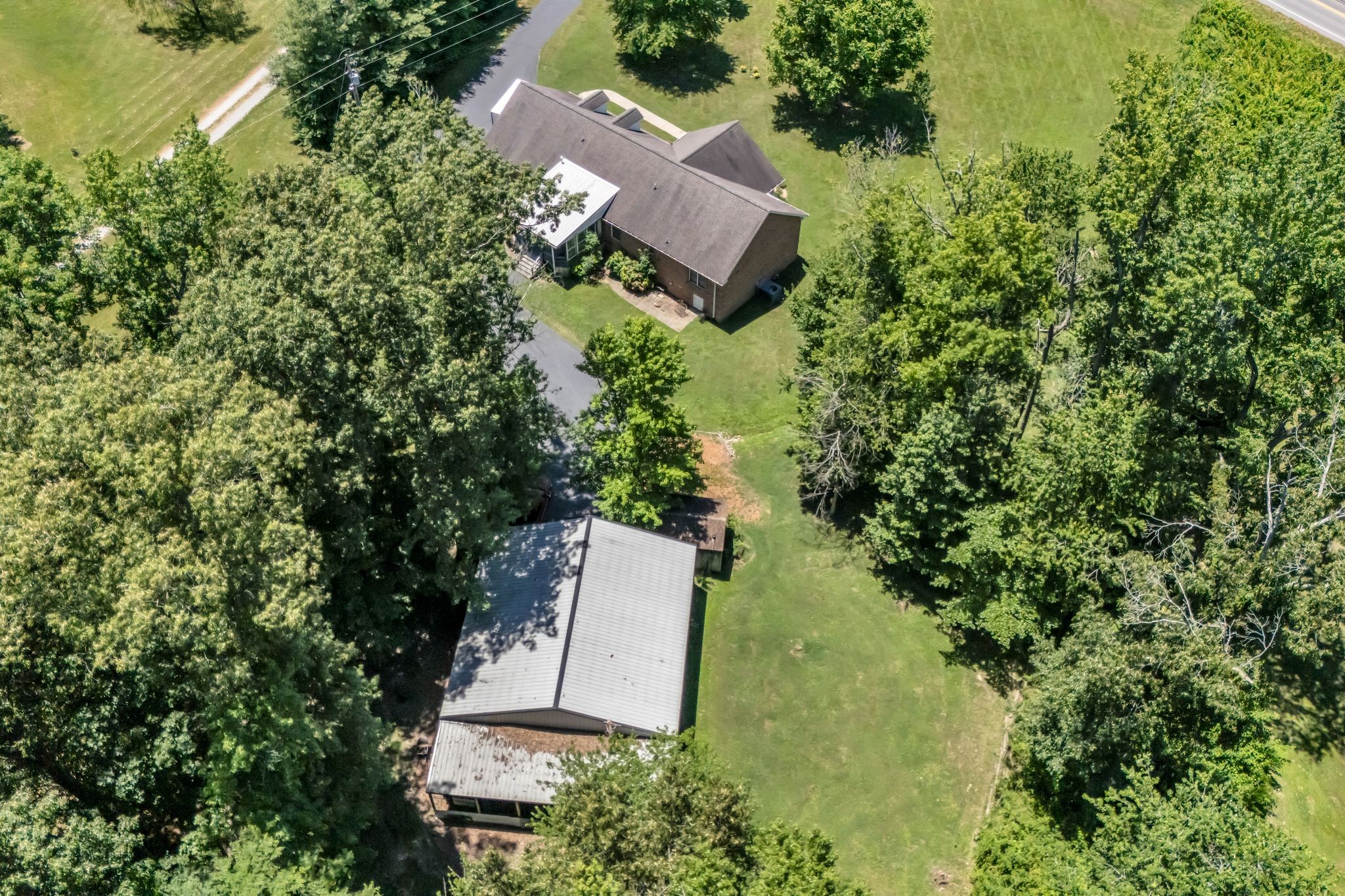 4111 Highway 49 Springfield, TN 37172 - Photo 40 of 46 an aerial view of a house with a yard and trees all around
