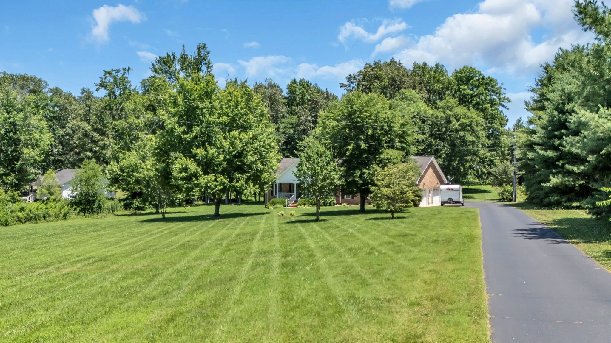 4111 Highway 49 Springfield, TN 37172 - Photo 4 of 46 a view of a house with a big yard and a large tree