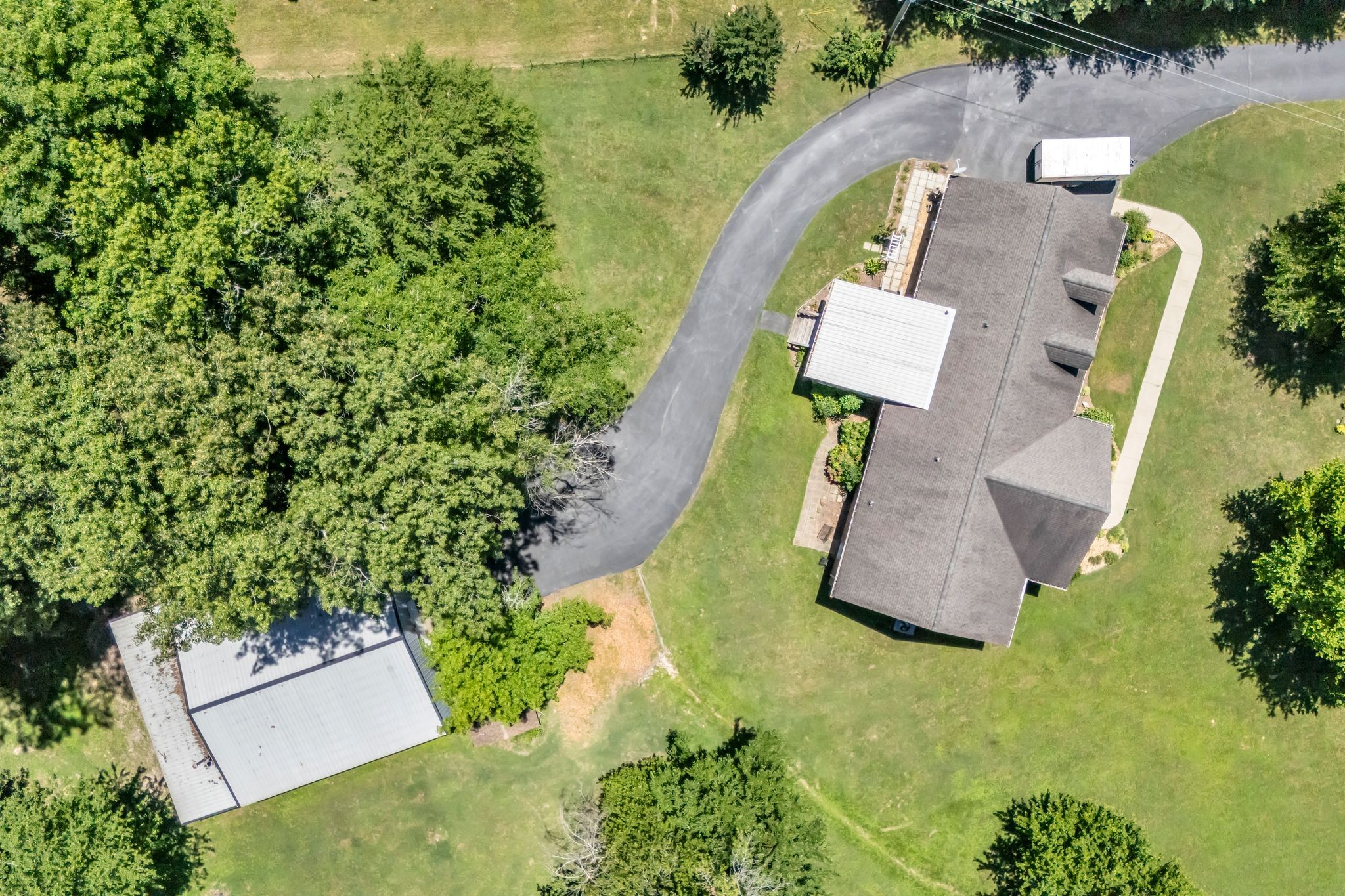 4111 Highway 49 Springfield, TN 37172 - Photo 43 of 46 an aerial view of a house with outdoor space and swimming pool