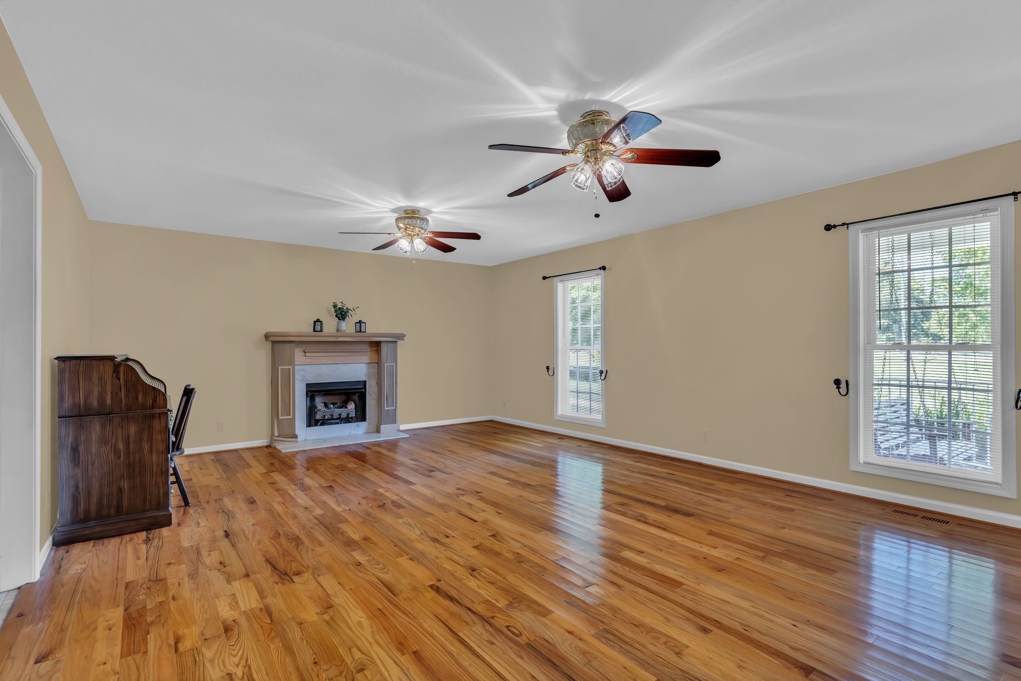 4111 Highway 49 Springfield, TN 37172 - Photo 10 of 46 wooden floor fireplace and windows in an empty room