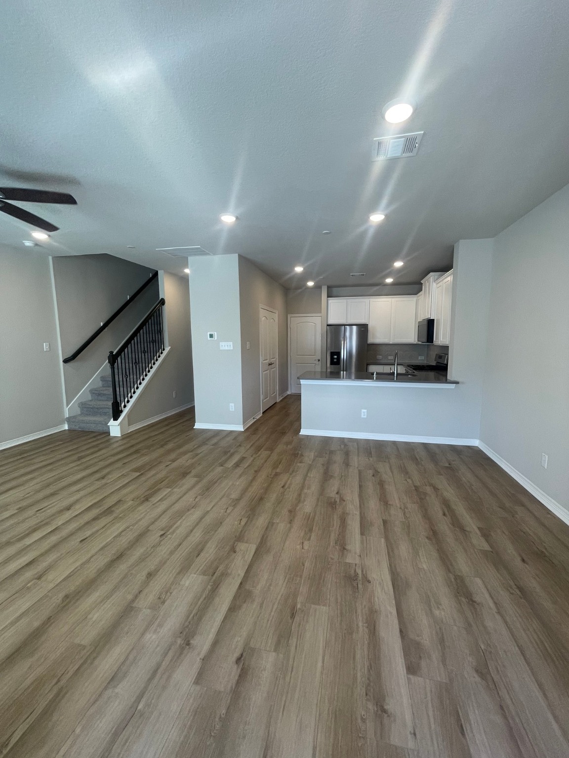 8024 Scanlan Trail Missouri City, TX 77459 - Photo 2 of 11 a view of a kitchen with a sink and a stove top oven