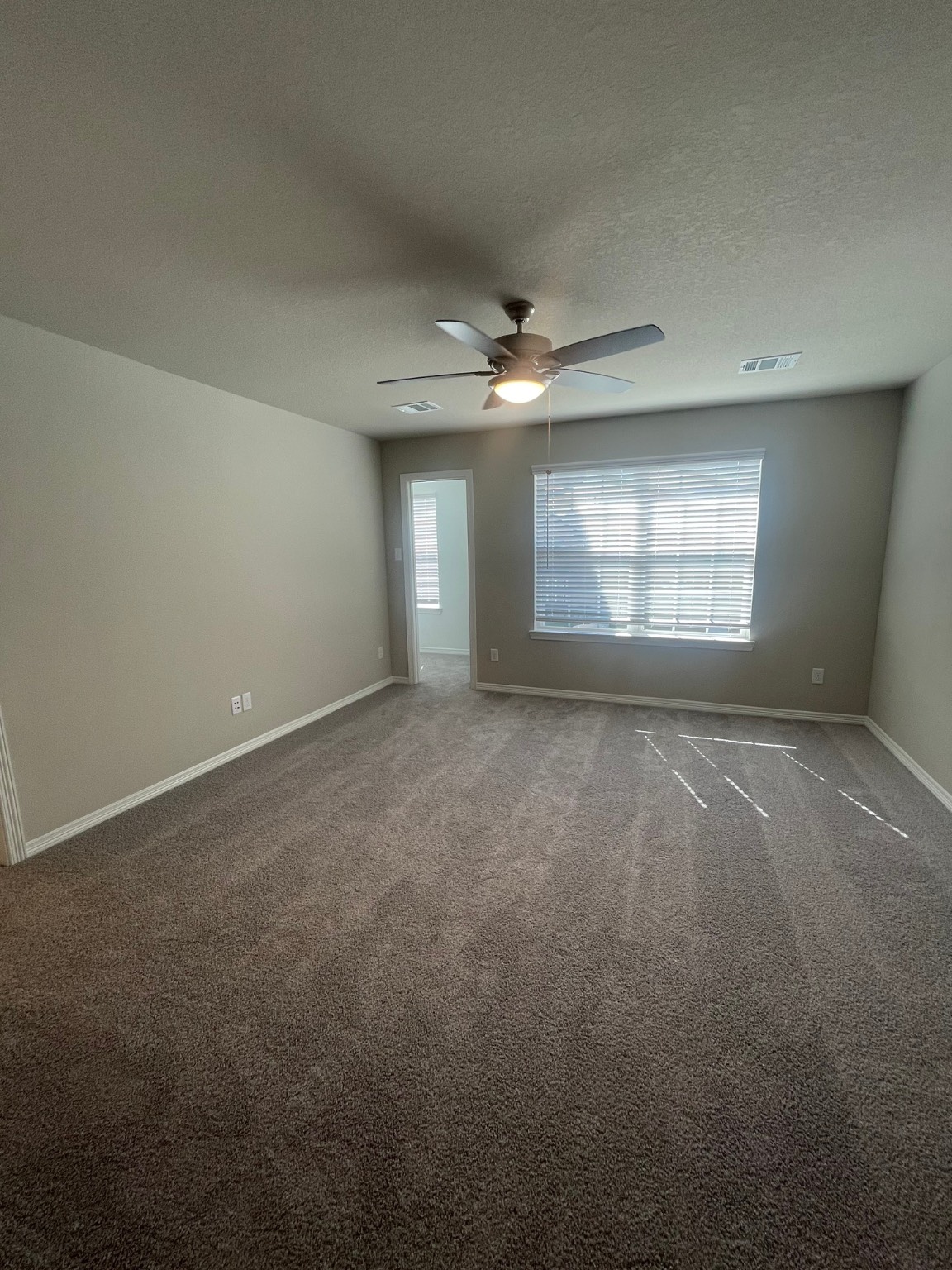 8024 Scanlan Trail Missouri City, TX 77459 - Photo 5 of 11 an empty room with a empty space and windows