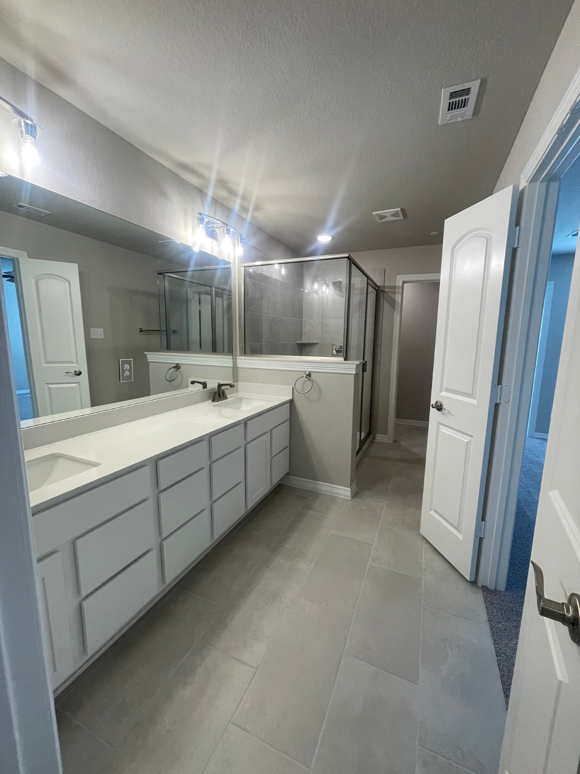 8024 Scanlan Trail Missouri City, TX 77459 - Photo 7 of 11 a bathroom with a double vanity sink and mirror