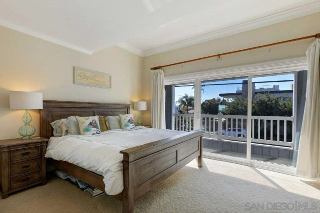 a bedroom with a bed and a view of bedroom