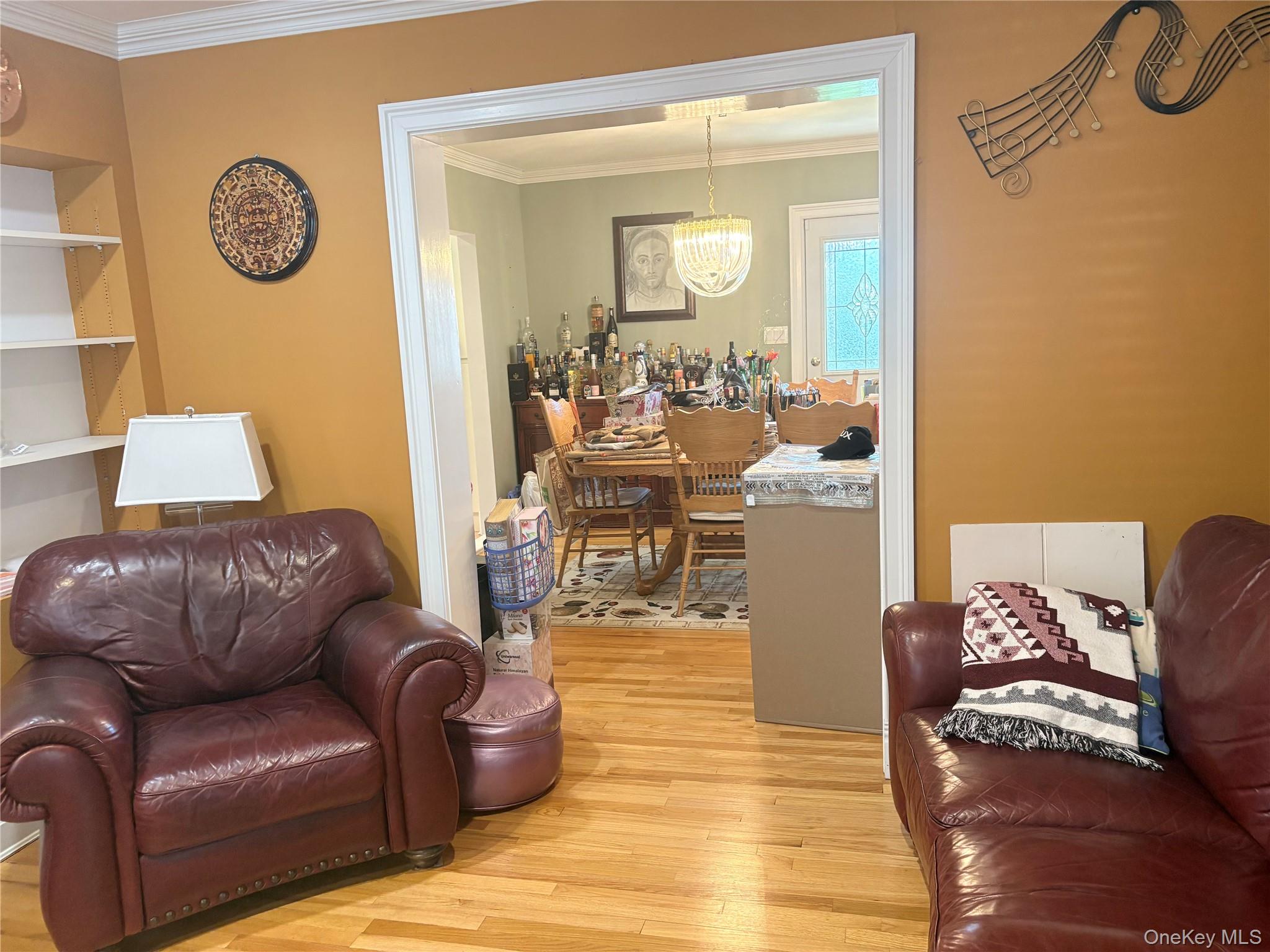 25 Rutland Road Freeport, NY 11520 - Photo 16 of 31 a living room with furniture and a mirror