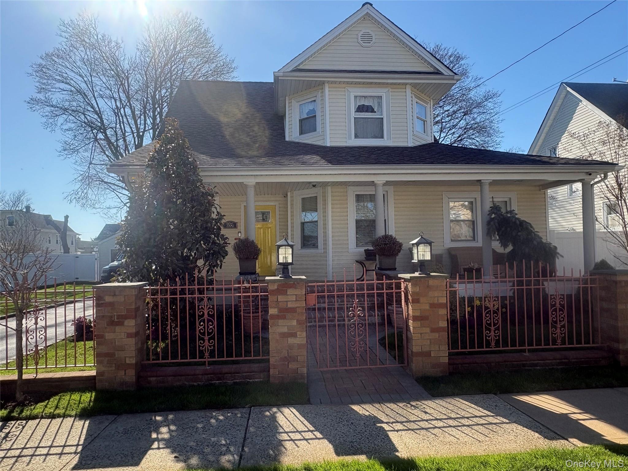 25 Rutland Road Freeport, NY 11520 - Photo 19 of 31 a view of a house with a porch