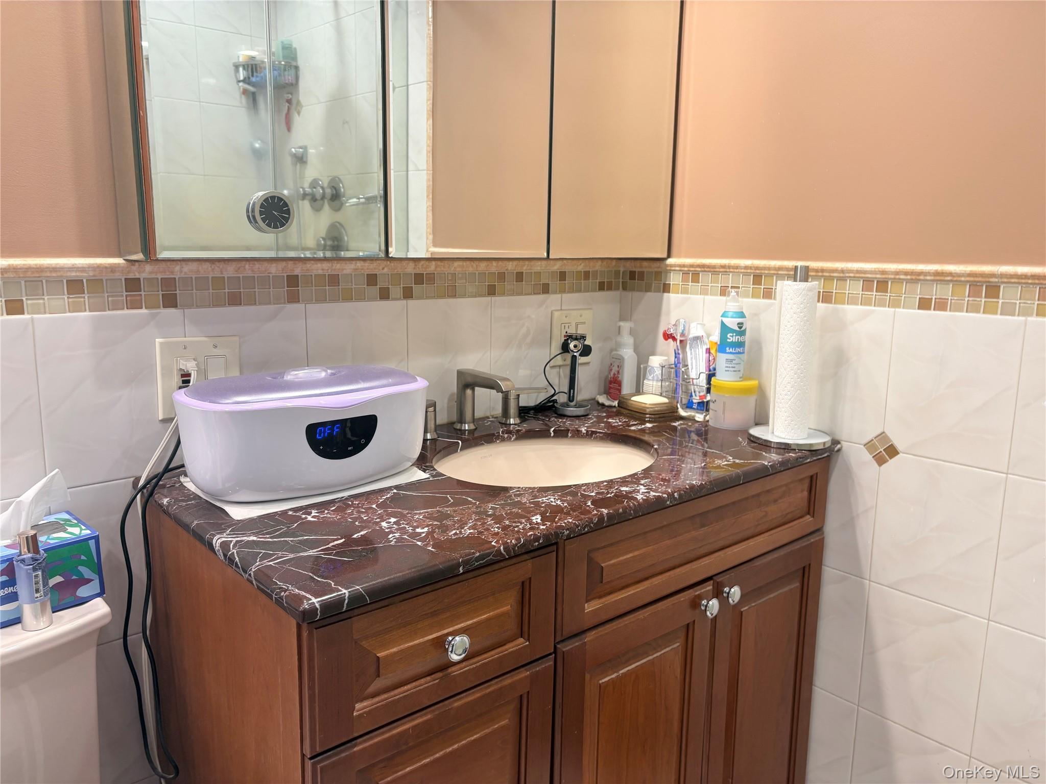 25 Rutland Road Freeport, NY 11520 - Photo 22 of 31 a sink and a stove sitting inside of a kitchen