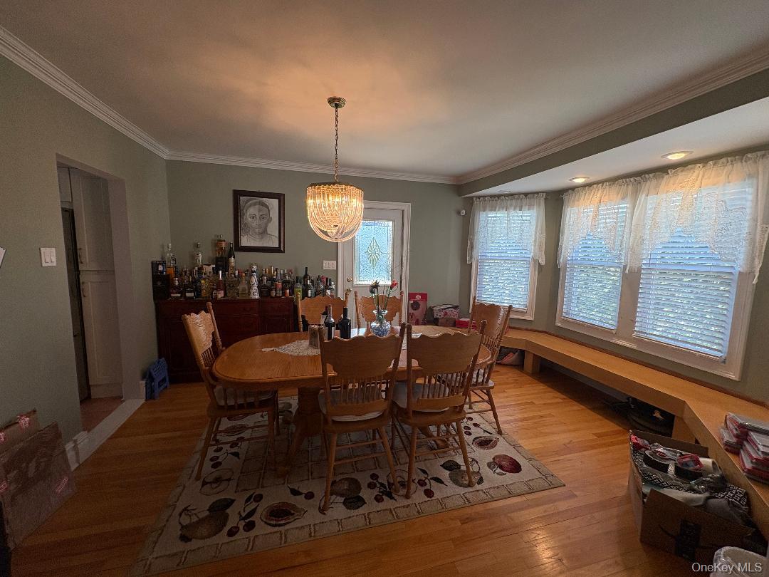 25 Rutland Road Freeport, NY 11520 - Photo 24 of 31 a view of a dining room with furniture window and wooden floor