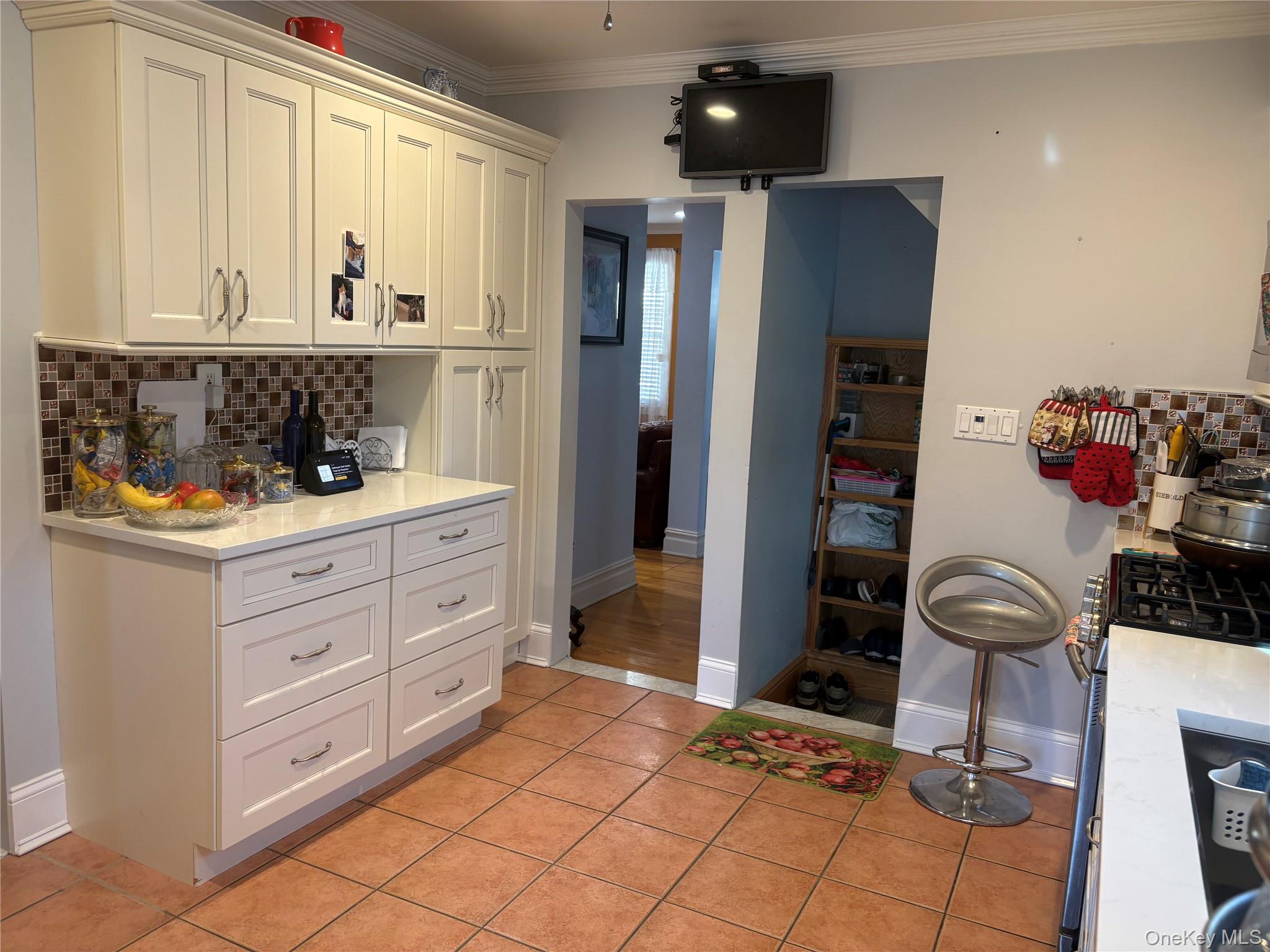 25 Rutland Road Freeport, NY 11520 - Photo 10 of 31 a room with stainless steel appliances kitchen island granite countertop a refrigerator and cabinets