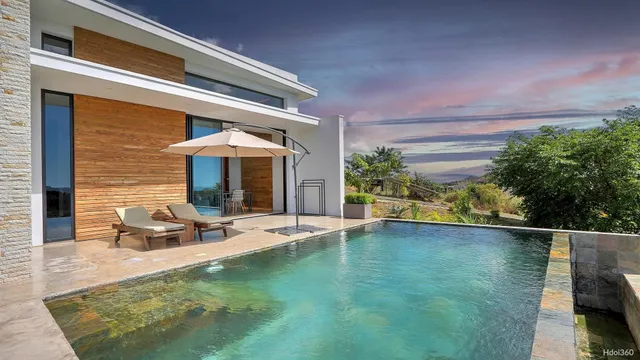 a front view of a house with swimming pool