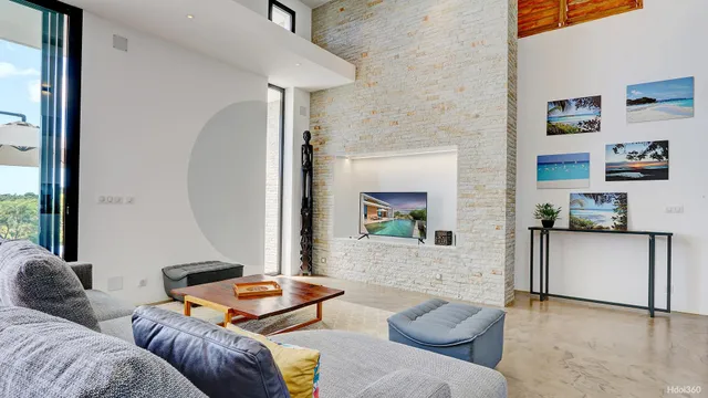 a living room with furniture and a rug