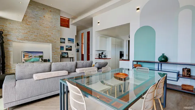 a living room with furniture and a floor to ceiling window