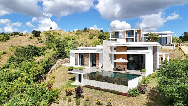 a view of a house with swimming pool and porch with furniture