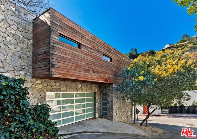 a front view of a house with a garage
