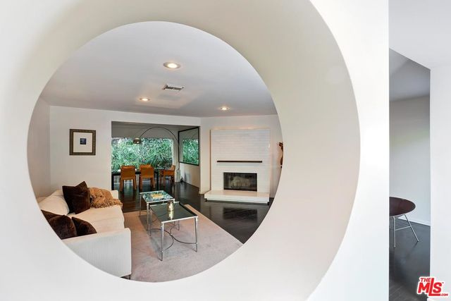a view of living room with furniture and a large window