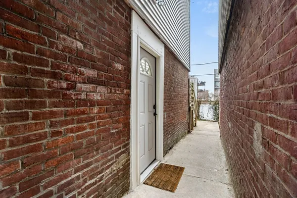 a view of a house with a door and stairs