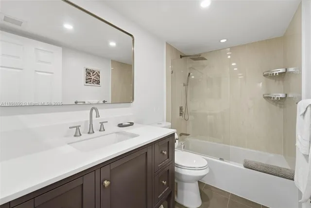 a bedroom with a bed and a table in it