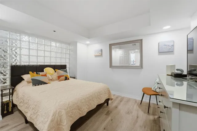 a view of a kitchen with a sink and cabinets