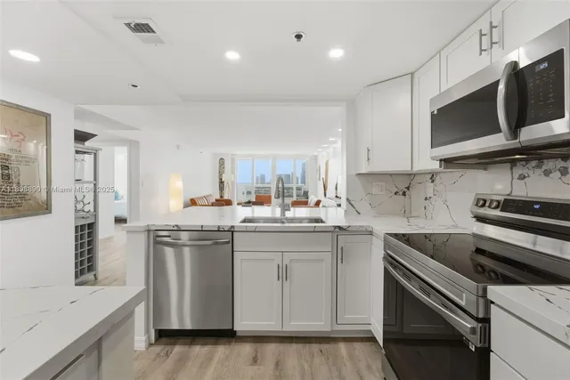 a kitchen with a table and chairs in it
