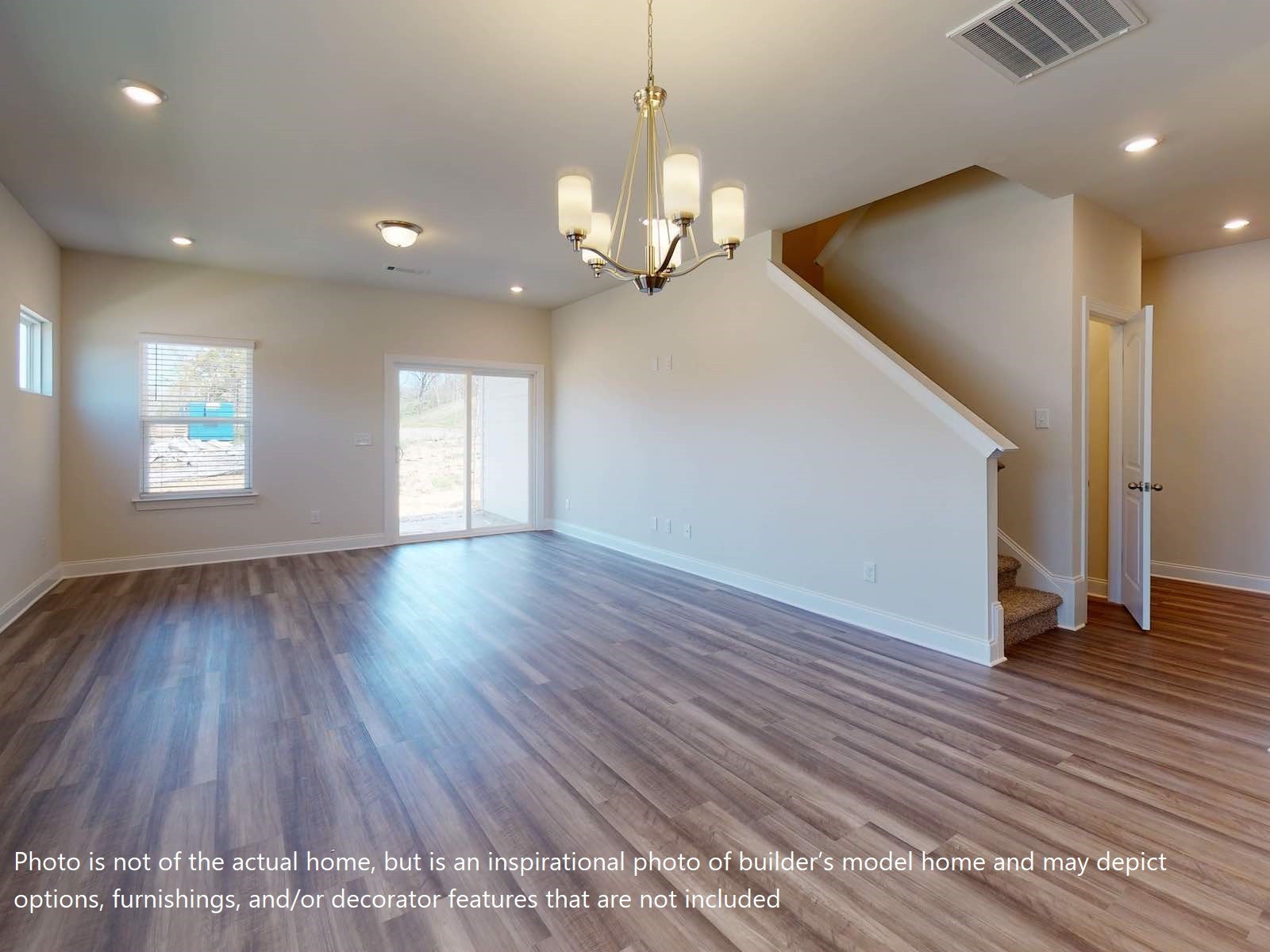 1100 Holland Ridge Way Lebanon, TN 37090 - Photo 16 of 20 a view of an empty room with wooden floor and a window