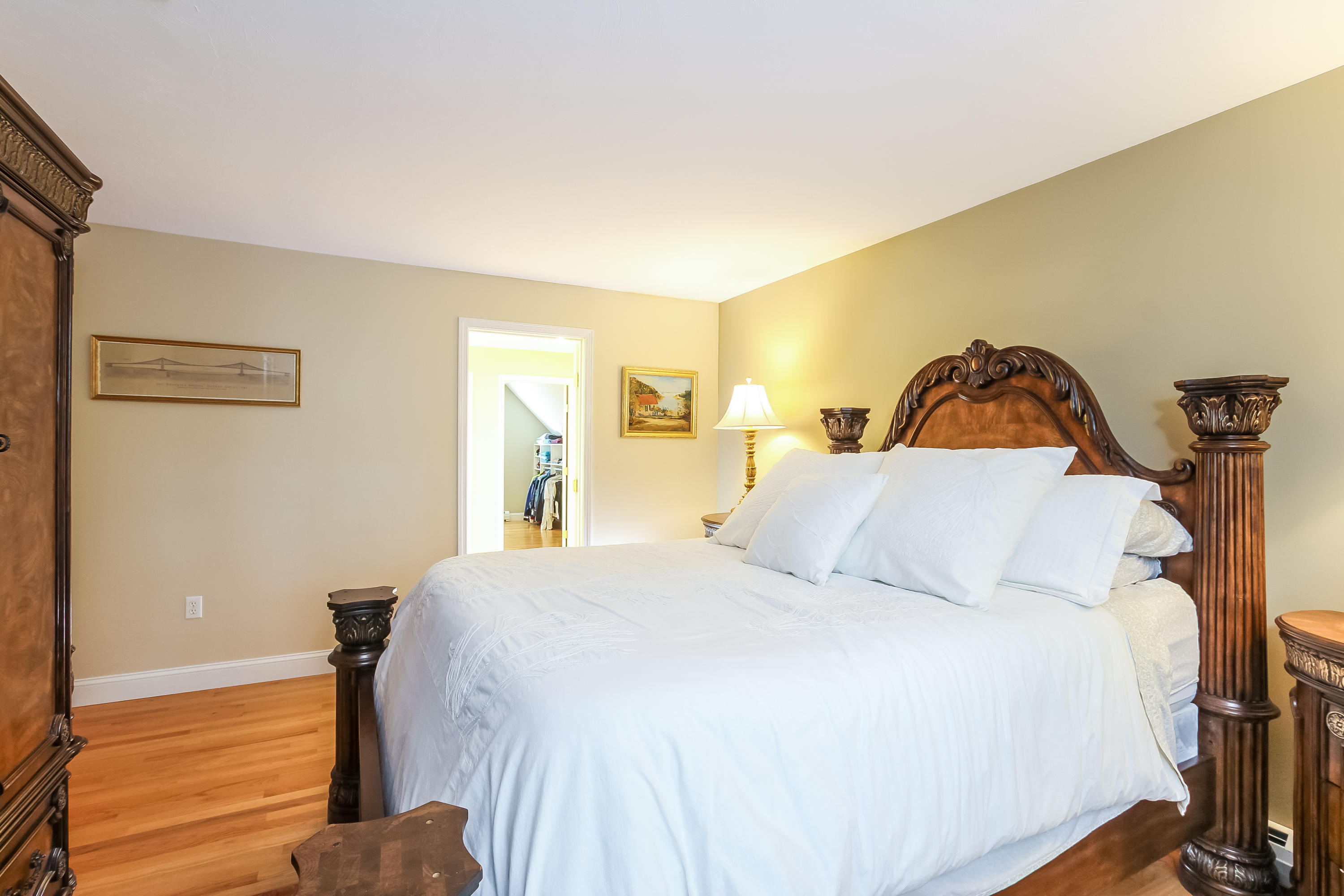 694 Santuit Road Cotuit, MA 02635 - Photo 20 of 35 a bedroom with a bed and a painting on the wall