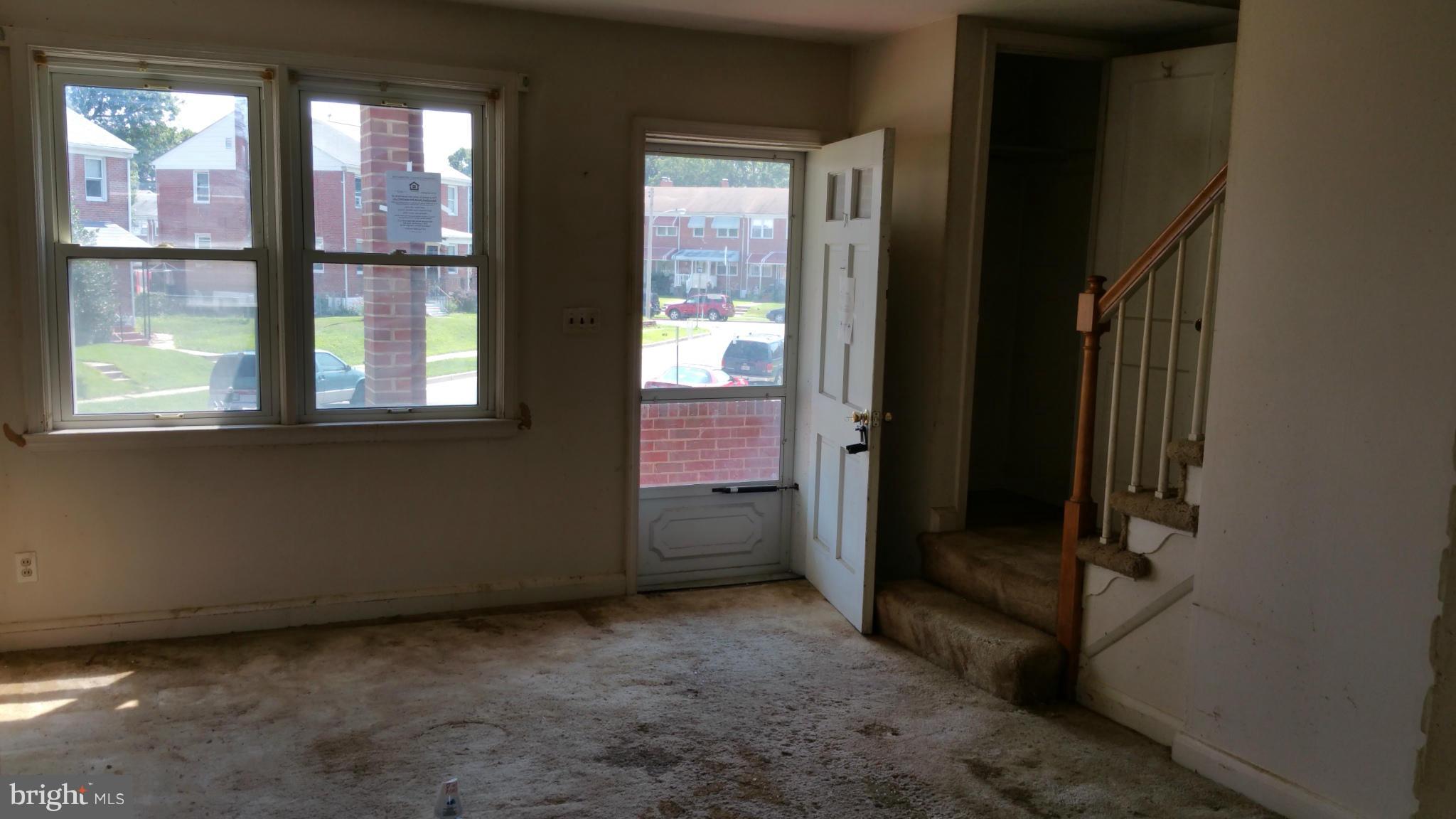 516 Chalcot Square Baltimore, MD 21221 - Photo 7 of 10 a view of an empty room with a window