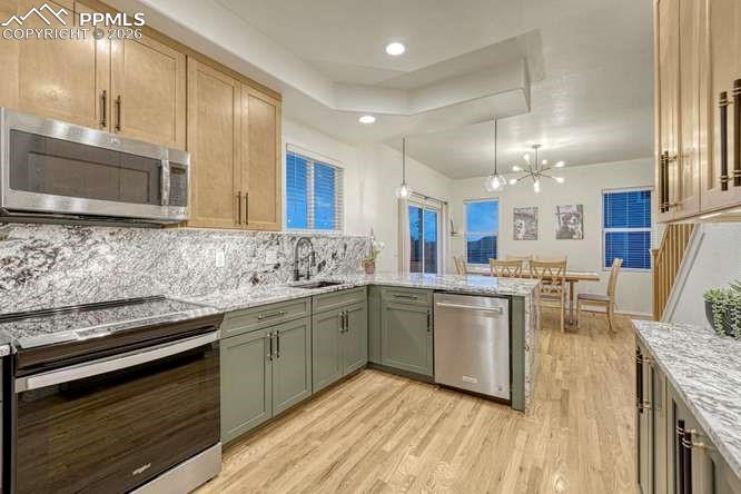 12365 Point Reyes Drive Peyton, CO 80831 - Photo 12 of 44 Kitchen hardwood floor, new cabinets, new range.