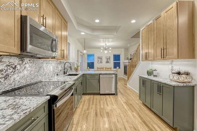 12365 Point Reyes Drive Peyton, CO 80831 - Photo 2 of 44 Kitchen with view into the dining area.