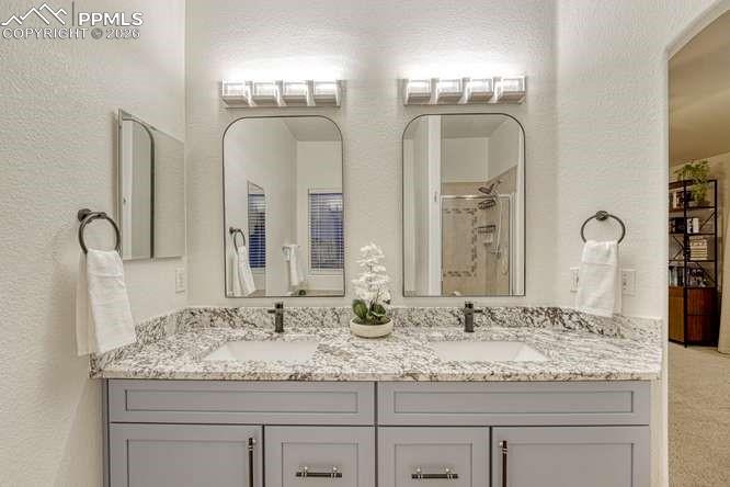 12365 Point Reyes Drive Peyton, CO 80831 - Photo 22 of 44 Primary bathroom dual vanity. 5 piece bathroom