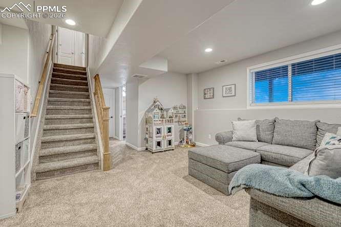 12365 Point Reyes Drive Peyton, CO 80831 - Photo 25 of 44 Family room,garden level basement with golf course views