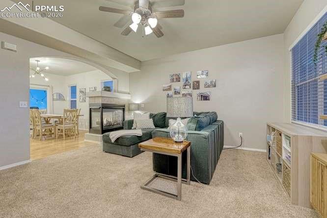12365 Point Reyes Drive Peyton, CO 80831 - Photo 7 of 44 Living room. Picture from the entryway. Dual Fireplace, open concept into the dining room.