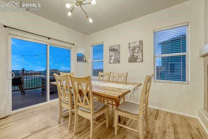 12365 Point Reyes Drive Peyton, CO 80831 - Photo 9 of 44 Dining area, hardwood floor. Sliding door out to the deck.