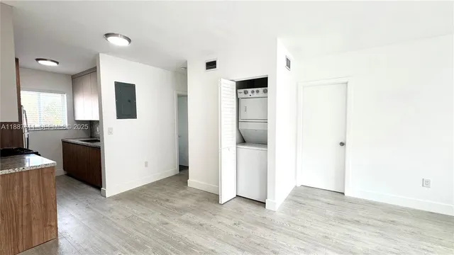 a view of a kitchen with wooden floor