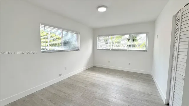 an empty room with windows