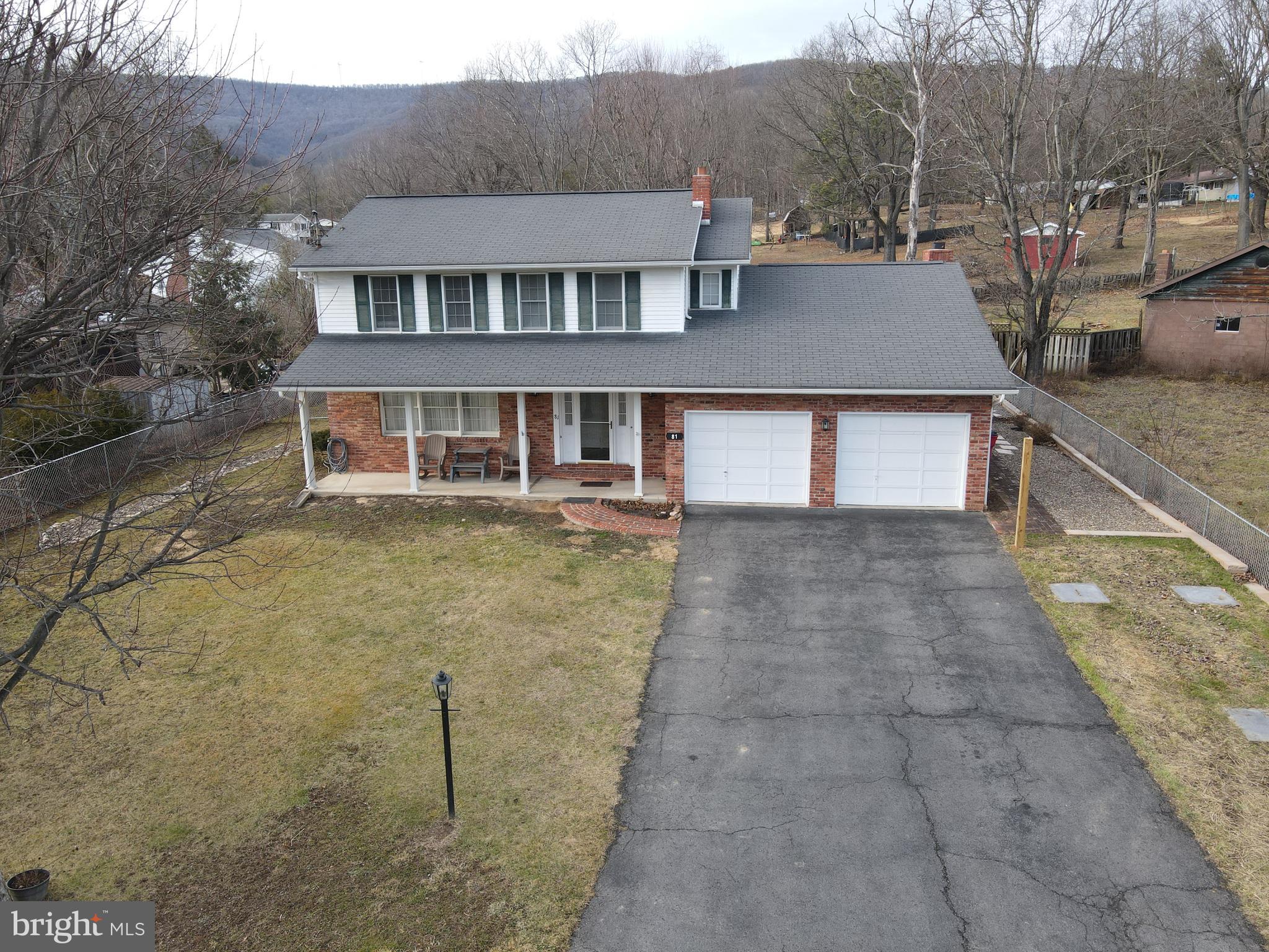 a aerial view of a house with a yard