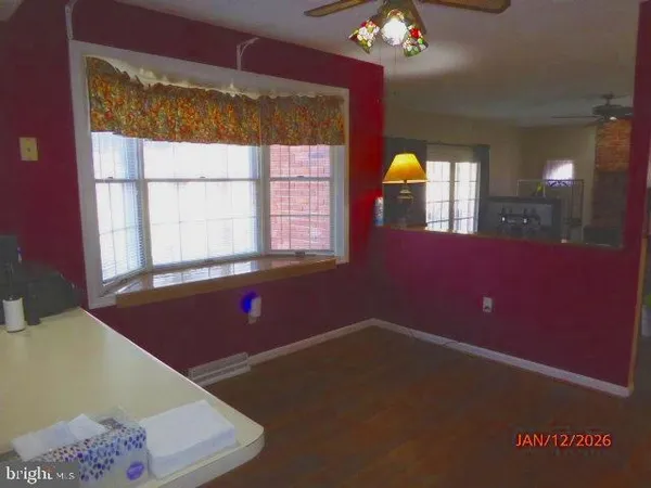 a kitchen with a refrigerator sink and cabinets