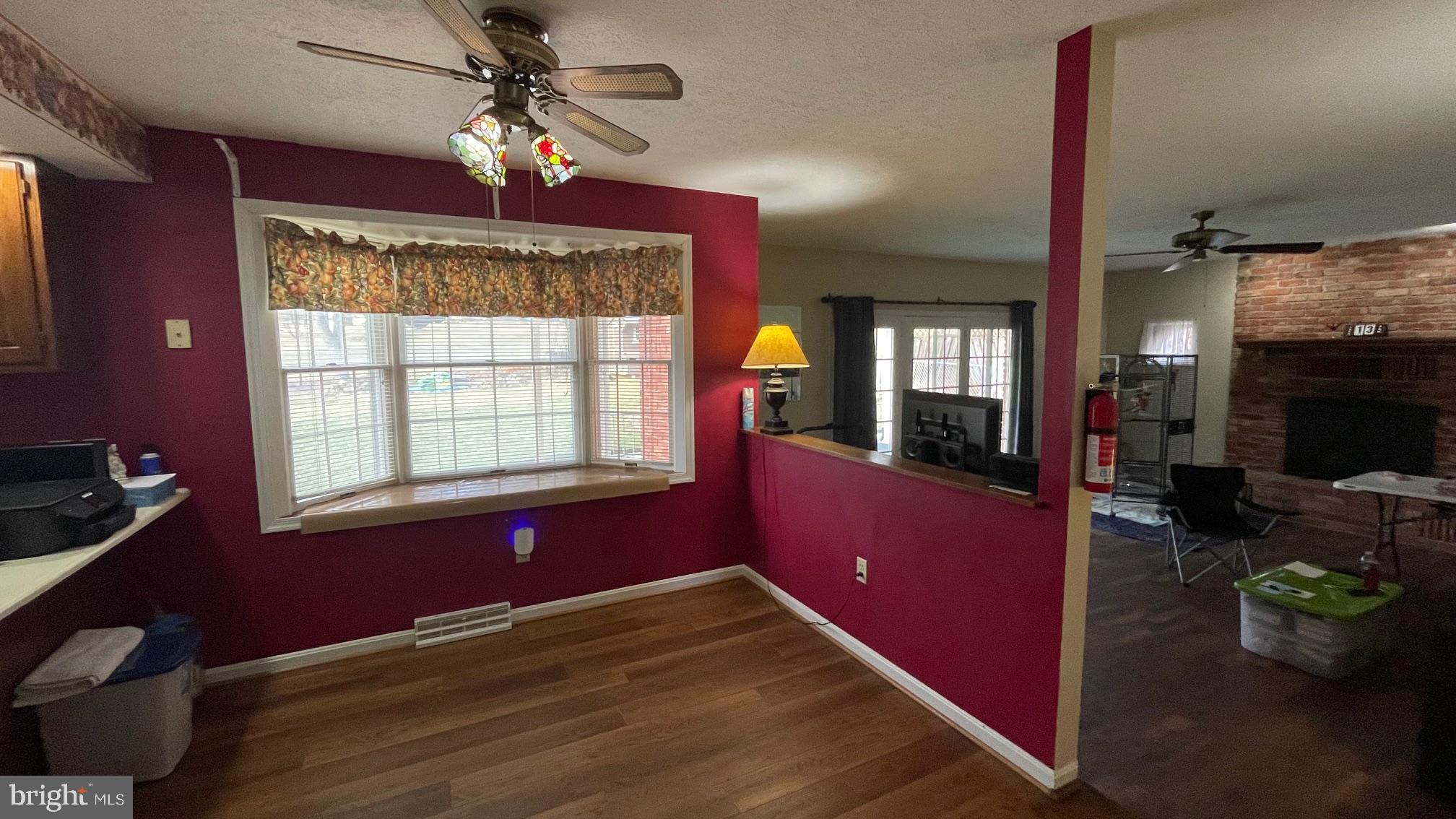 81 Lester Street Keyser, WV 26726 - Photo 12 of 75 a view of livingroom with furniture window and wooden floor
