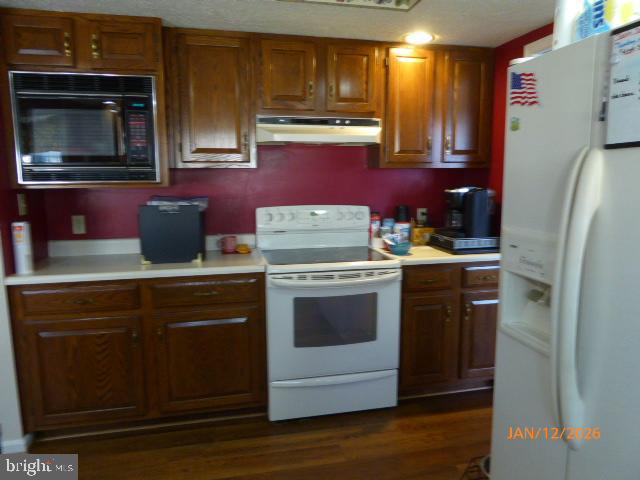 81 Lester Street Keyser, WV 26726 - Photo 19 of 75 a kitchen with stainless steel appliances a stove microwave and refrigerator