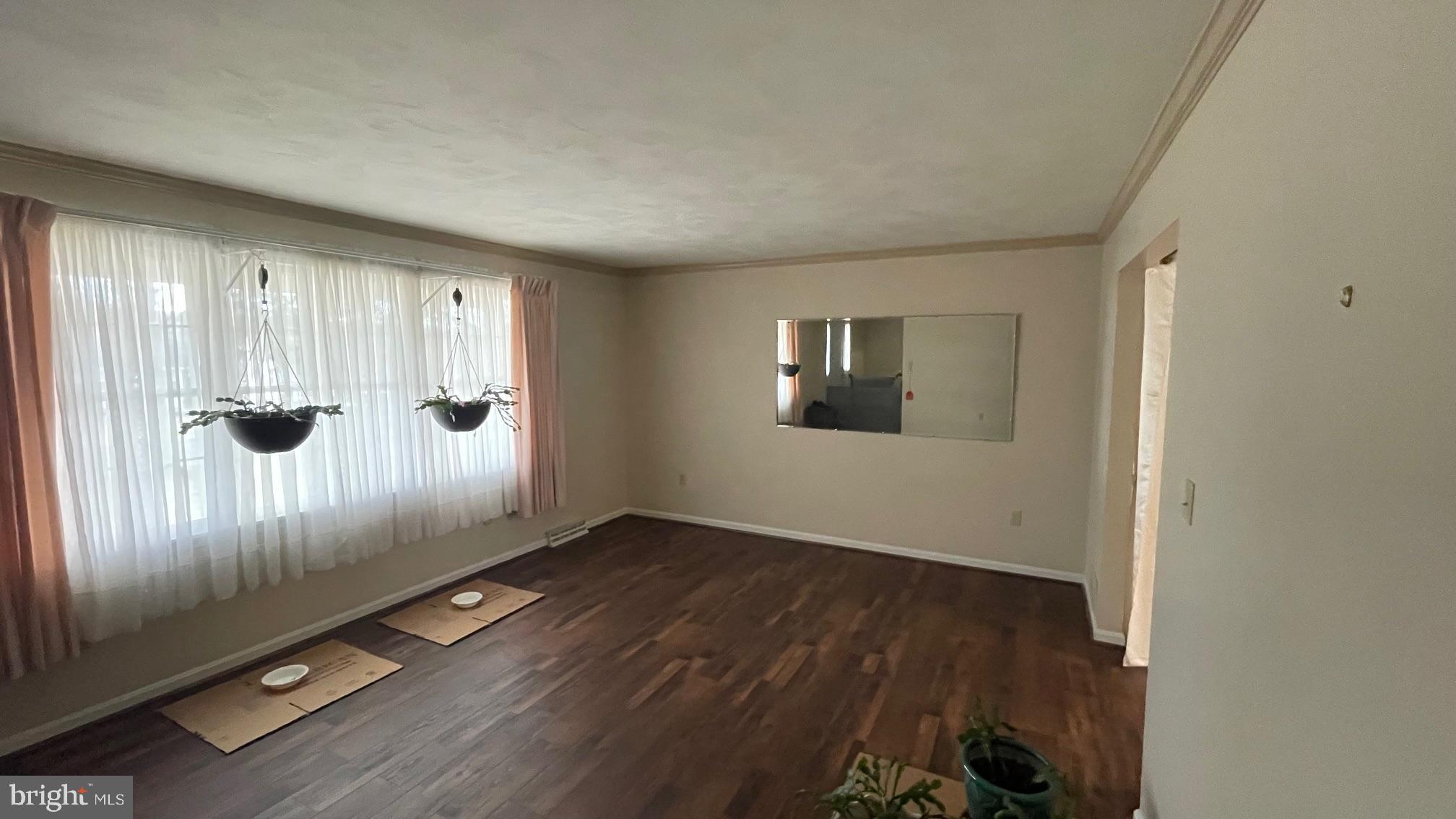 81 Lester Street Keyser, WV 26726 - Photo 27 of 75 an empty room with wooden floor and windows