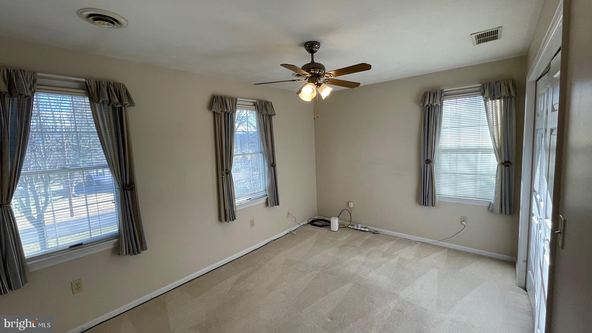 81 Lester Street Keyser, WV 26726 - Photo 38 of 75 wooden floor in an empty room with a window
