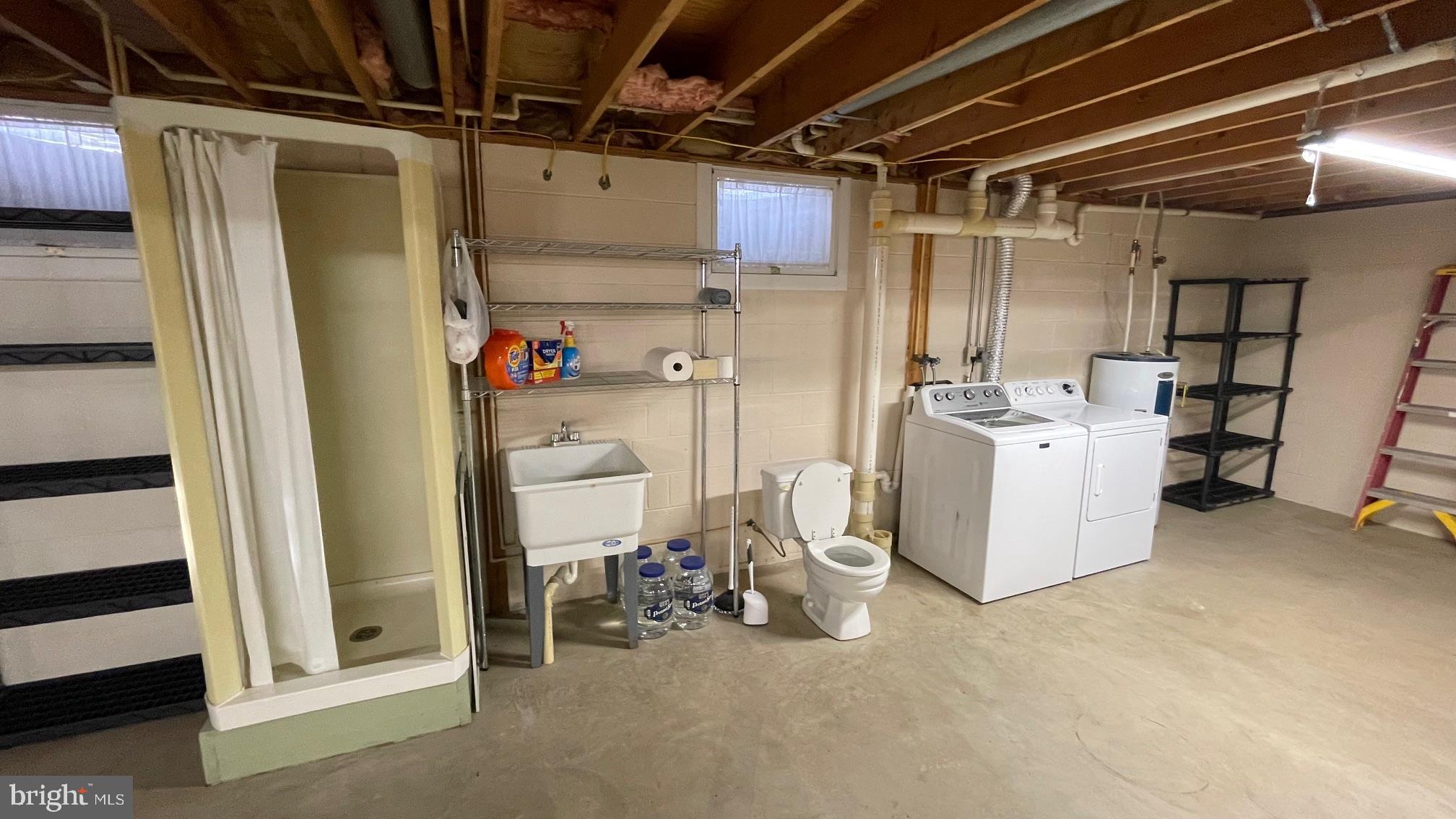 81 Lester Street Keyser, WV 26726 - Photo 42 of 75 a view of a storage & utility room with racks dryer